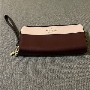 KATE SPADE Staci Lge  Wristlet Wallet bought with blemish on backside 2 indents